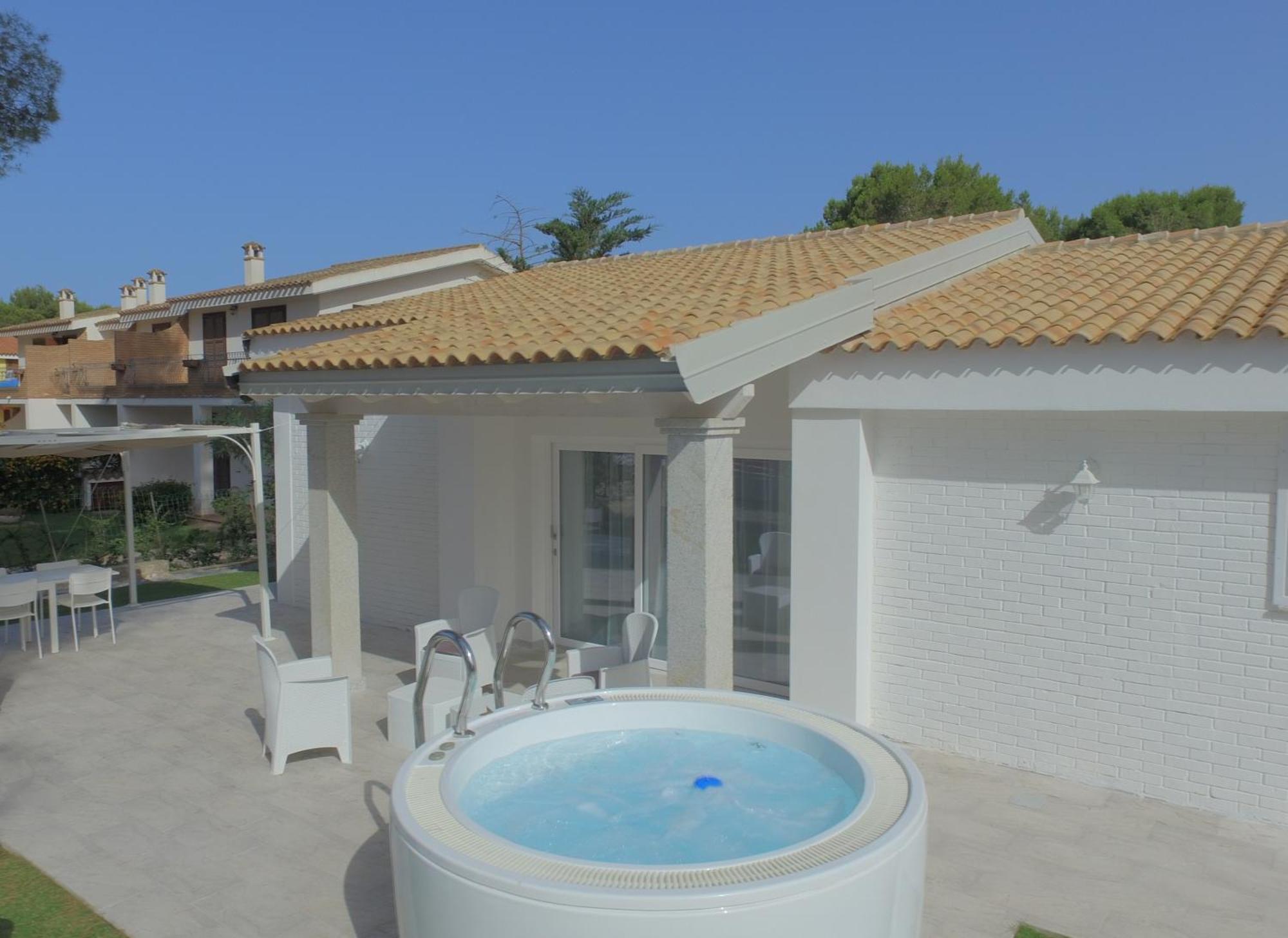 Ikebana Villas Porto Pino Beach Exterior foto